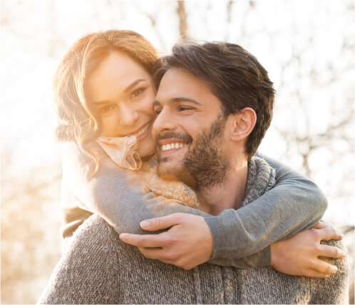 woman hugging man from behind