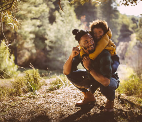 man hiking with son