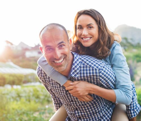 woman hugging man from behind