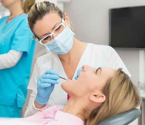 dentist examining a patient's teeth