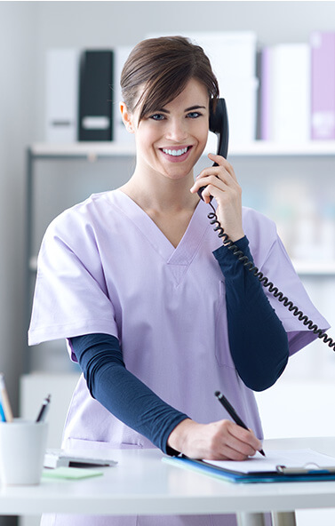 dental office receptionist talking on the phone